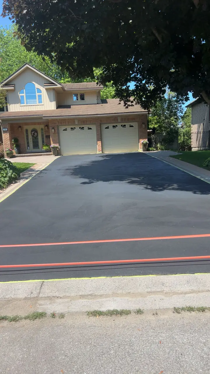 Freshly sealed asphalt driveway in Kingston