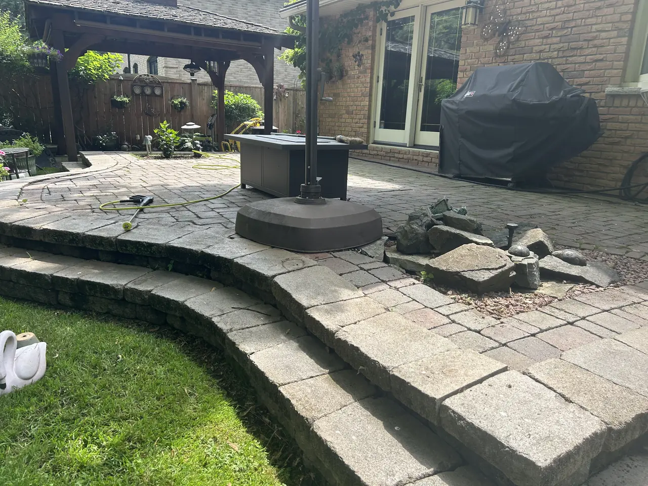 Stone patio before cleaning and interlock sealing in Kingston