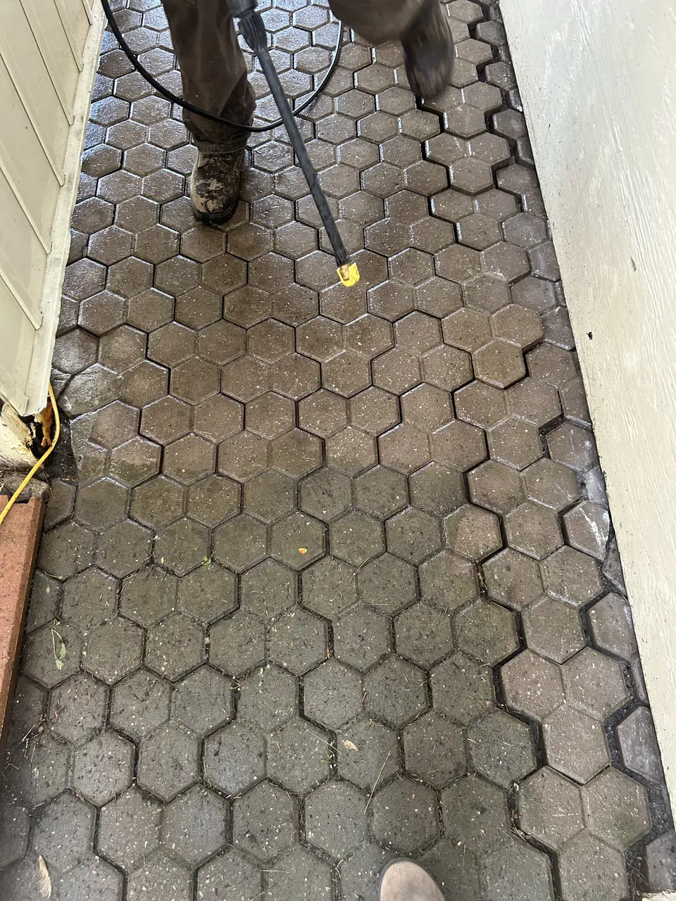 Pressure washing interlock pavers up close in Kingston