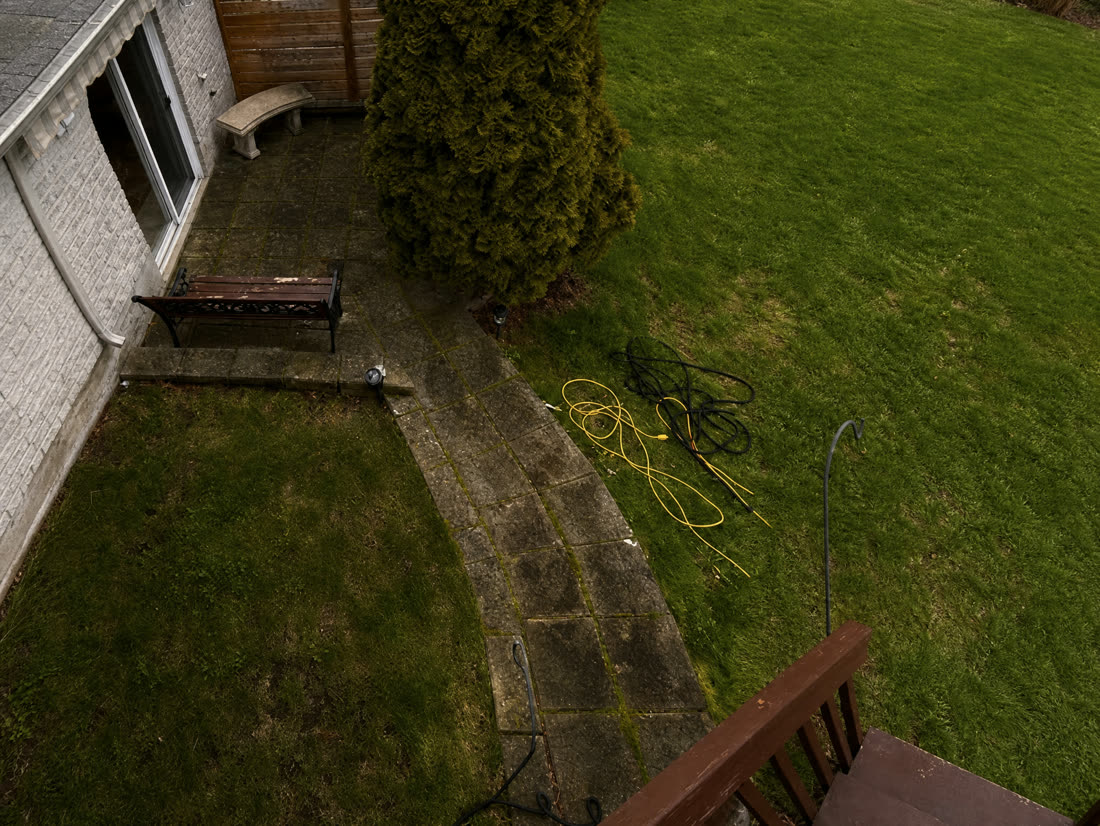 Stone patio before cleaning — algae and grime